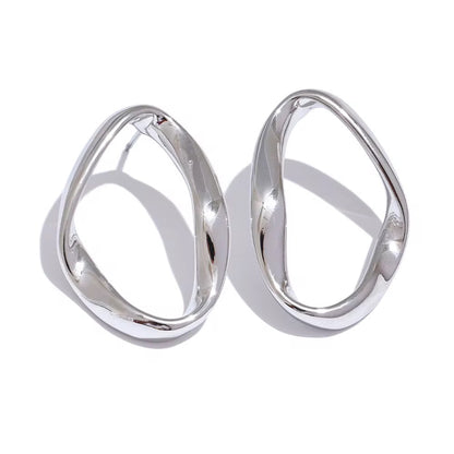 Pair of silver hoop earrings on a white background