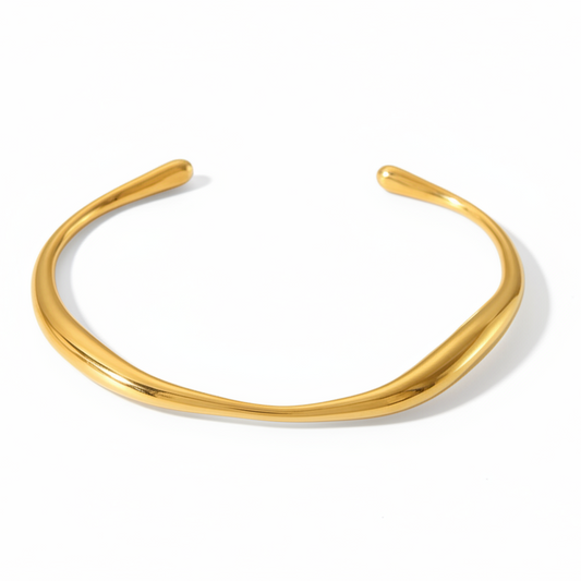 18K Gold plated bracelet on a light gray background