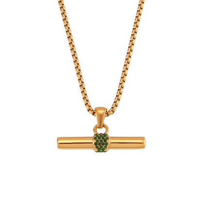 Gold necklace with a green gemstone pendant on a white background