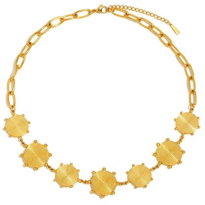 Gold necklace with circular floral pendants on a white background