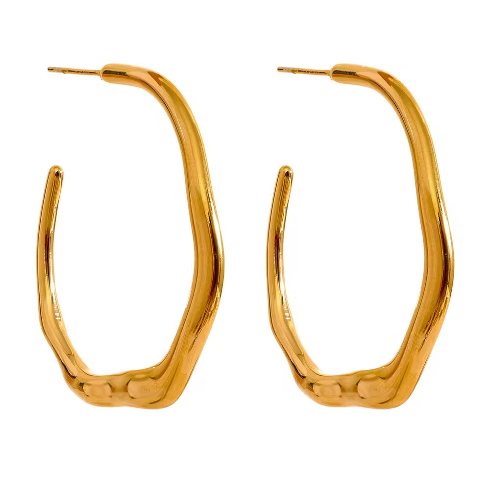 Irregular Gold hoop earrings on a white background