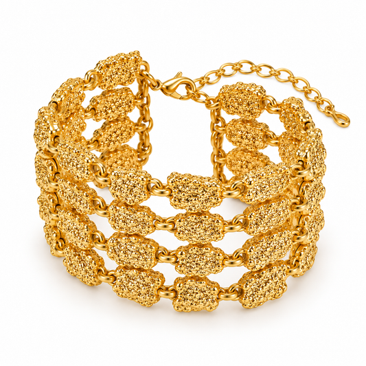 A gold-plated multi-strand cuff bracelet featuring textured, rounded links connected by a fine chain, shown on a clean white background.