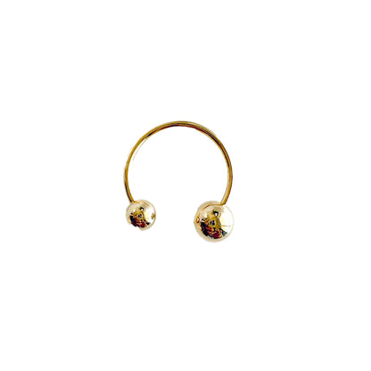 Herae Gold finger ring with two round gold balls on a white background