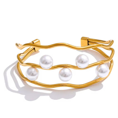 nontarnish Gold bracelet with pearls on a white background